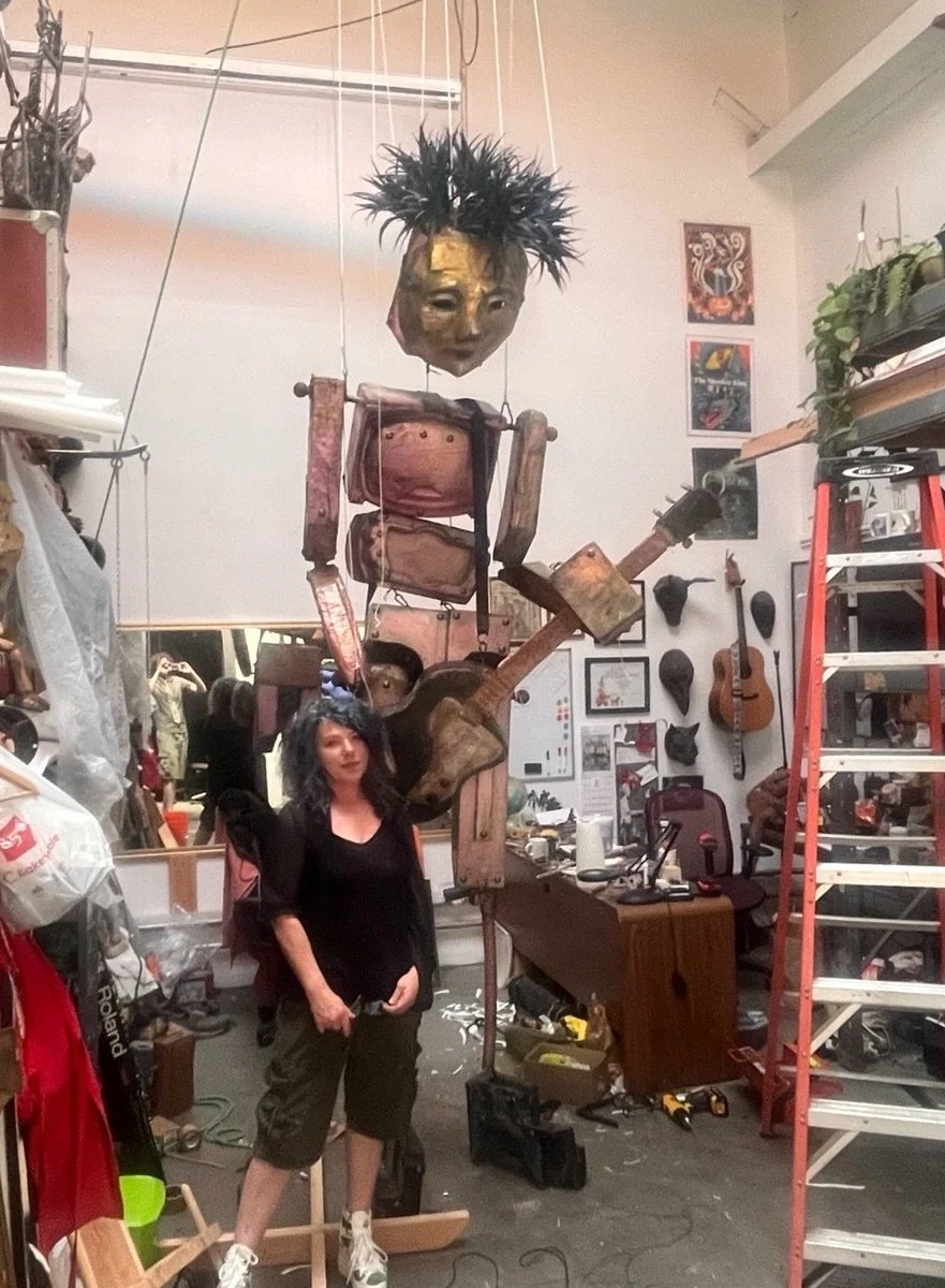 Lisa Zagone with giant marionette Los Bostistos for Eugene Rodriguez exhibit at MOAH Lancaster