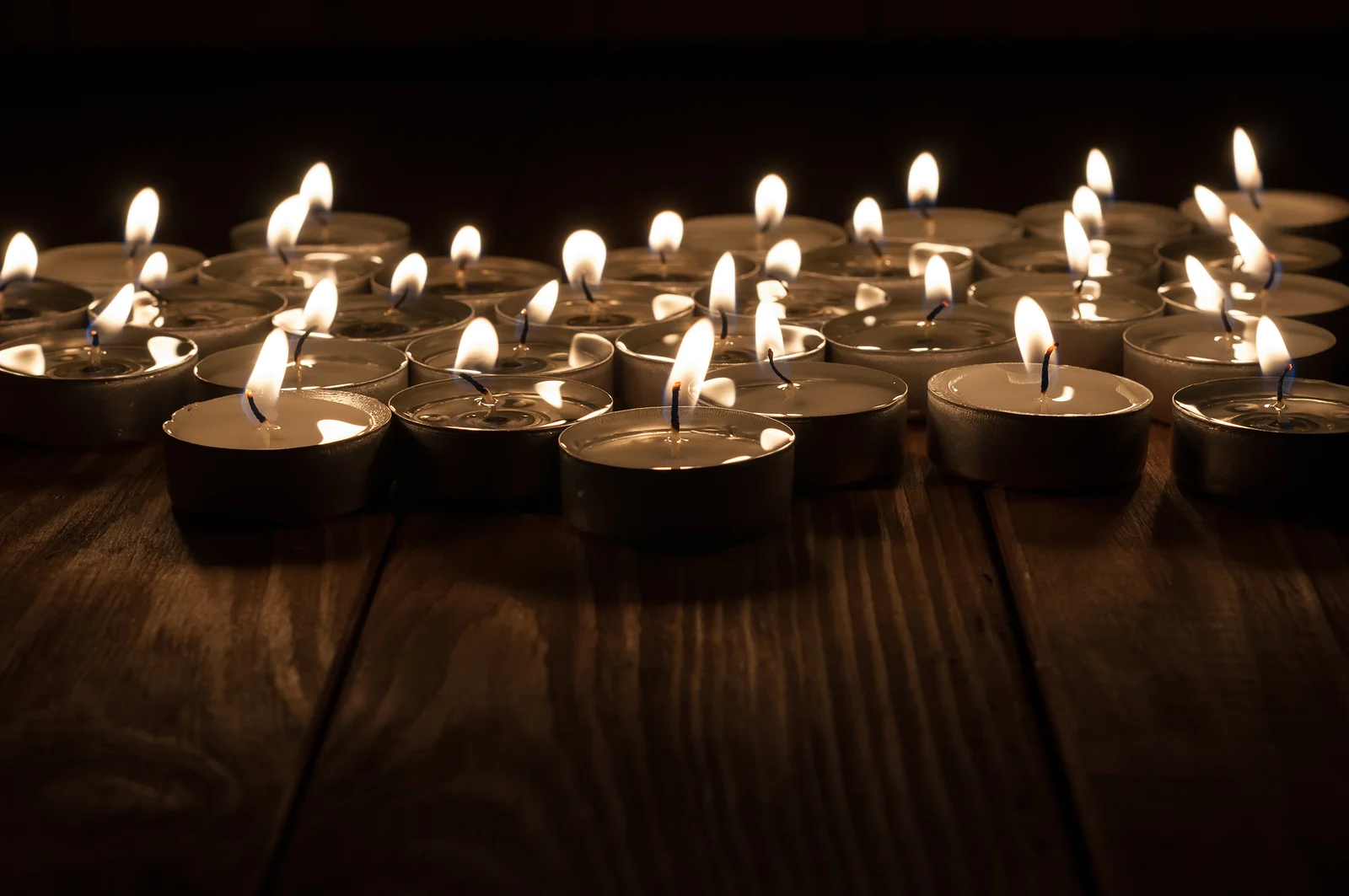 bigstock-Candles-on-old-wooden-backgrou-88738322.jpg