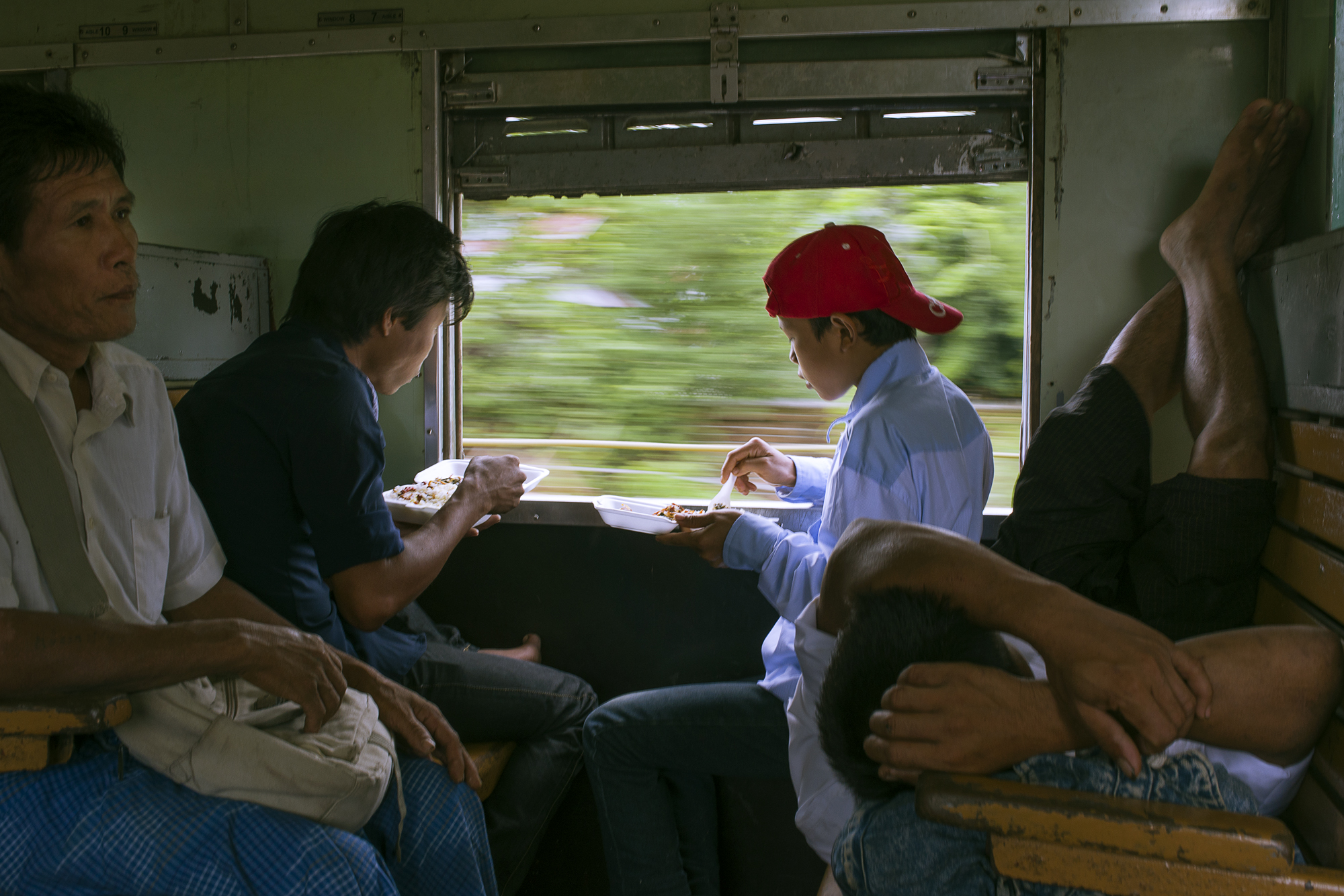 A family eats lunch on the economy class carriage 