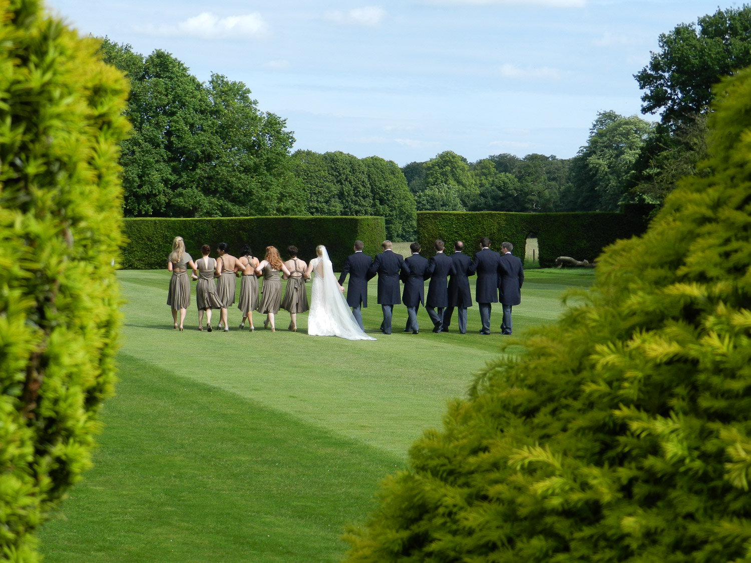 Gallery replacement No 3 Bridal party walking in garden.jpg