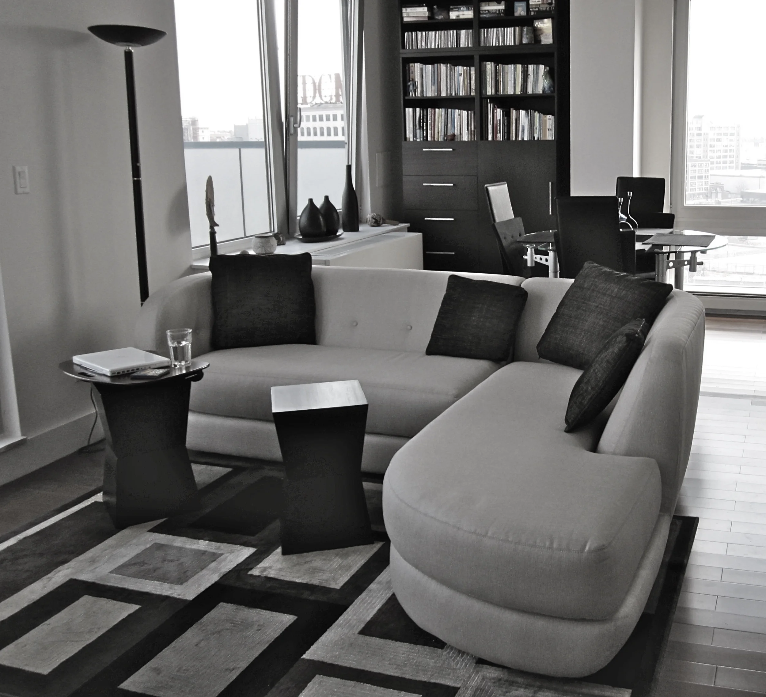  Living Area (before) Opened up floorspace by shifting rug-sofa relationship, eliminated outdated floor lamp and replaced with contemporary model from bedroom.&nbsp; 