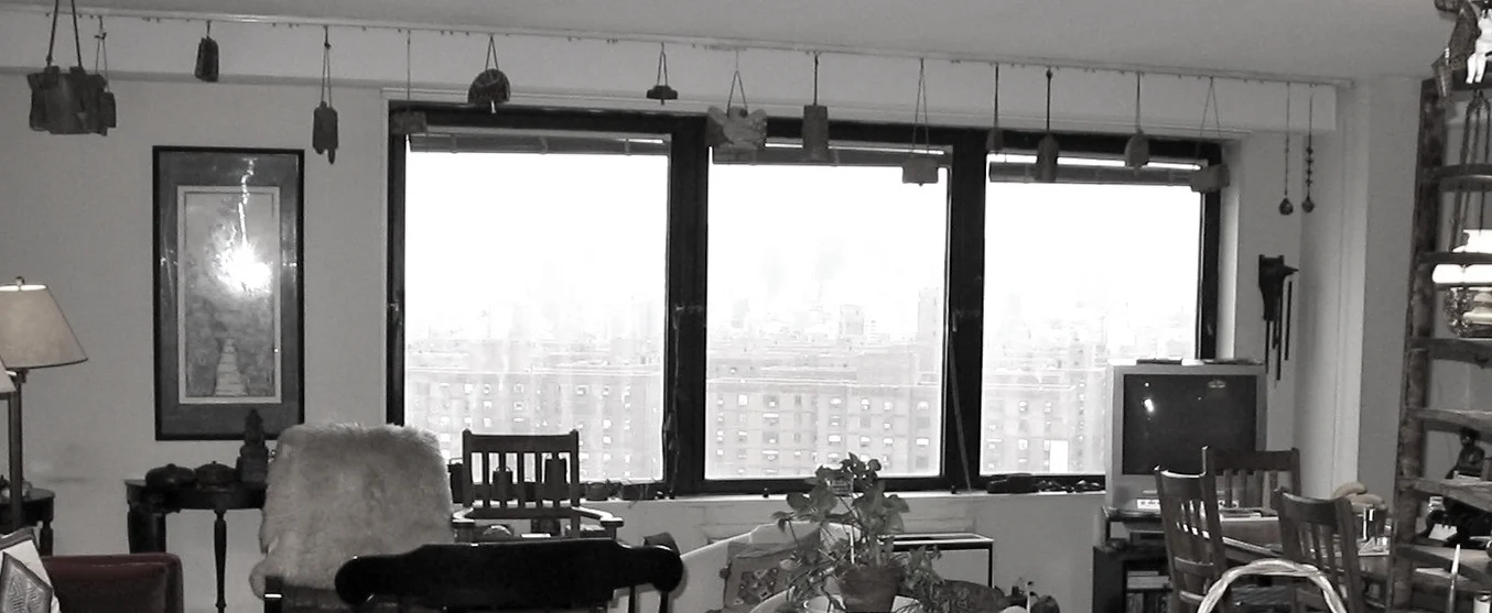  Living-Dining area (before) Collected hanging art cowbells from above window to combine into a new wall art installation piece (salon-style grouping of objects).&nbsp; 