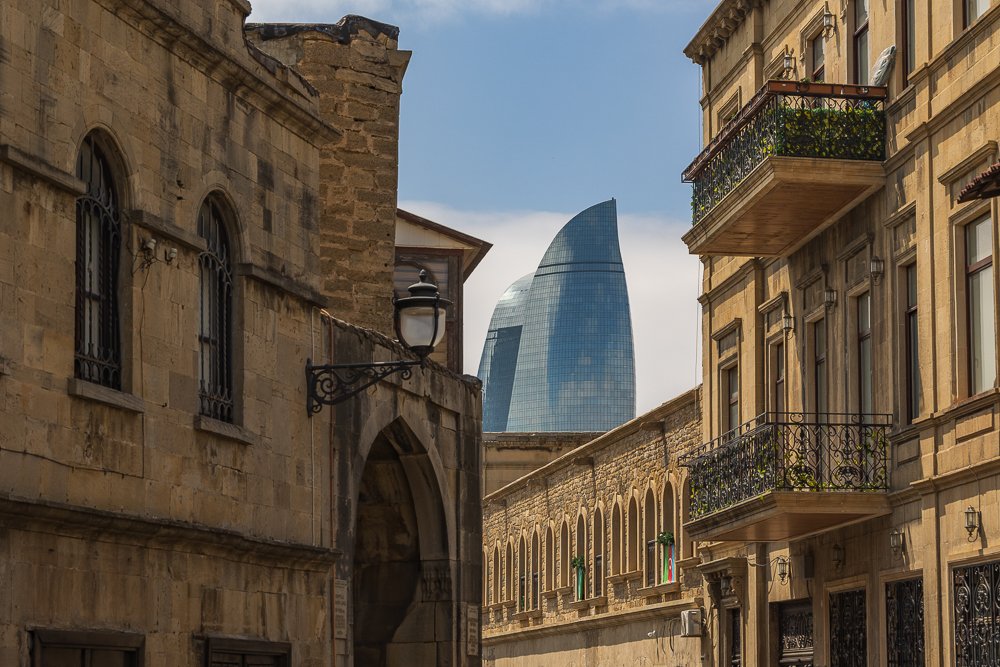   Baku:  Ancient walled city pressed against a skyline of towers designed to look like flames, all of it tilting toward the Caspian Sea.  