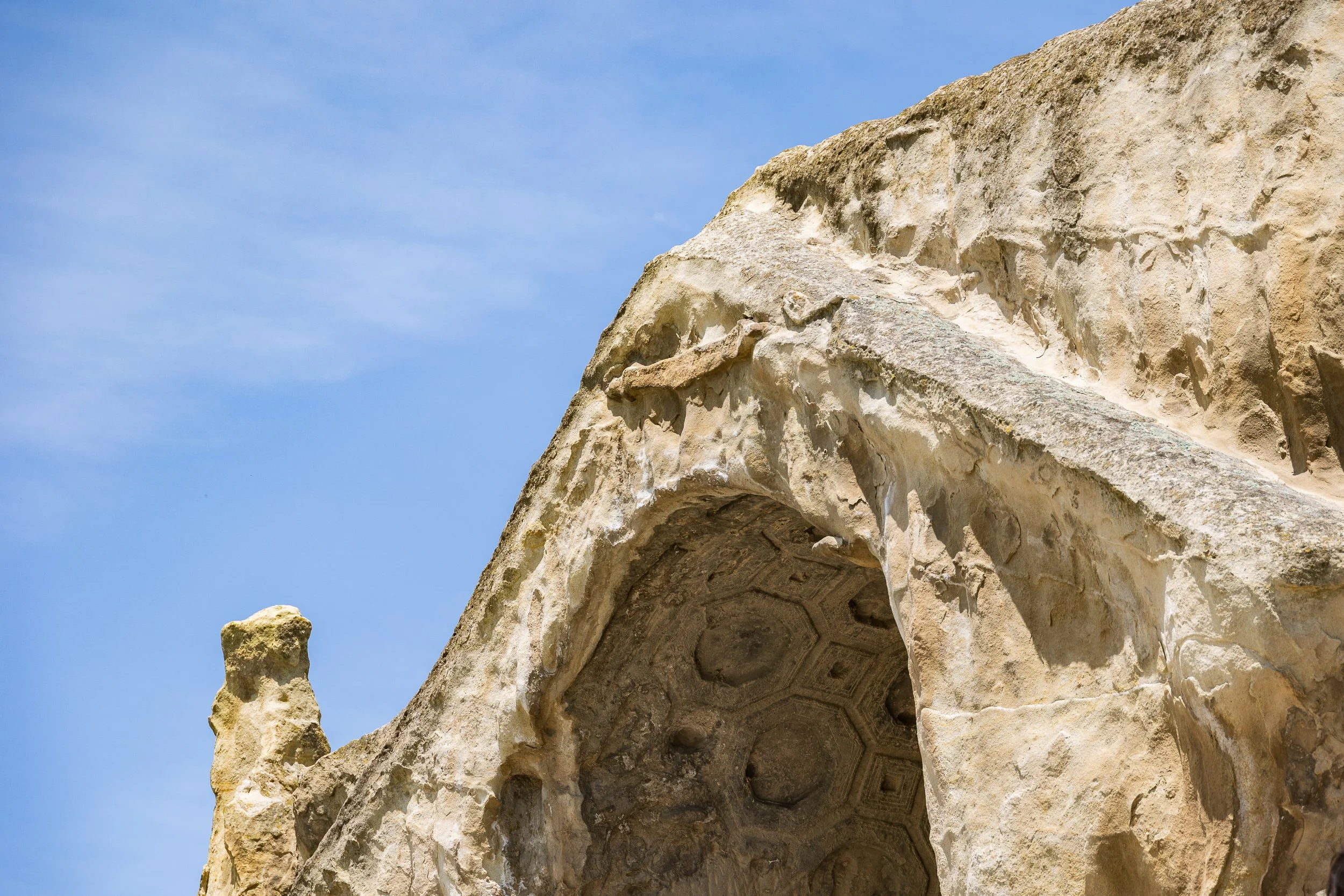  Many of the grand ceremonial spaces feature dramatic tunnel-vaulted ceilings. The soft sandstone has been carved with geometric squares and ribs, creating deep recessed panels called coffers. 