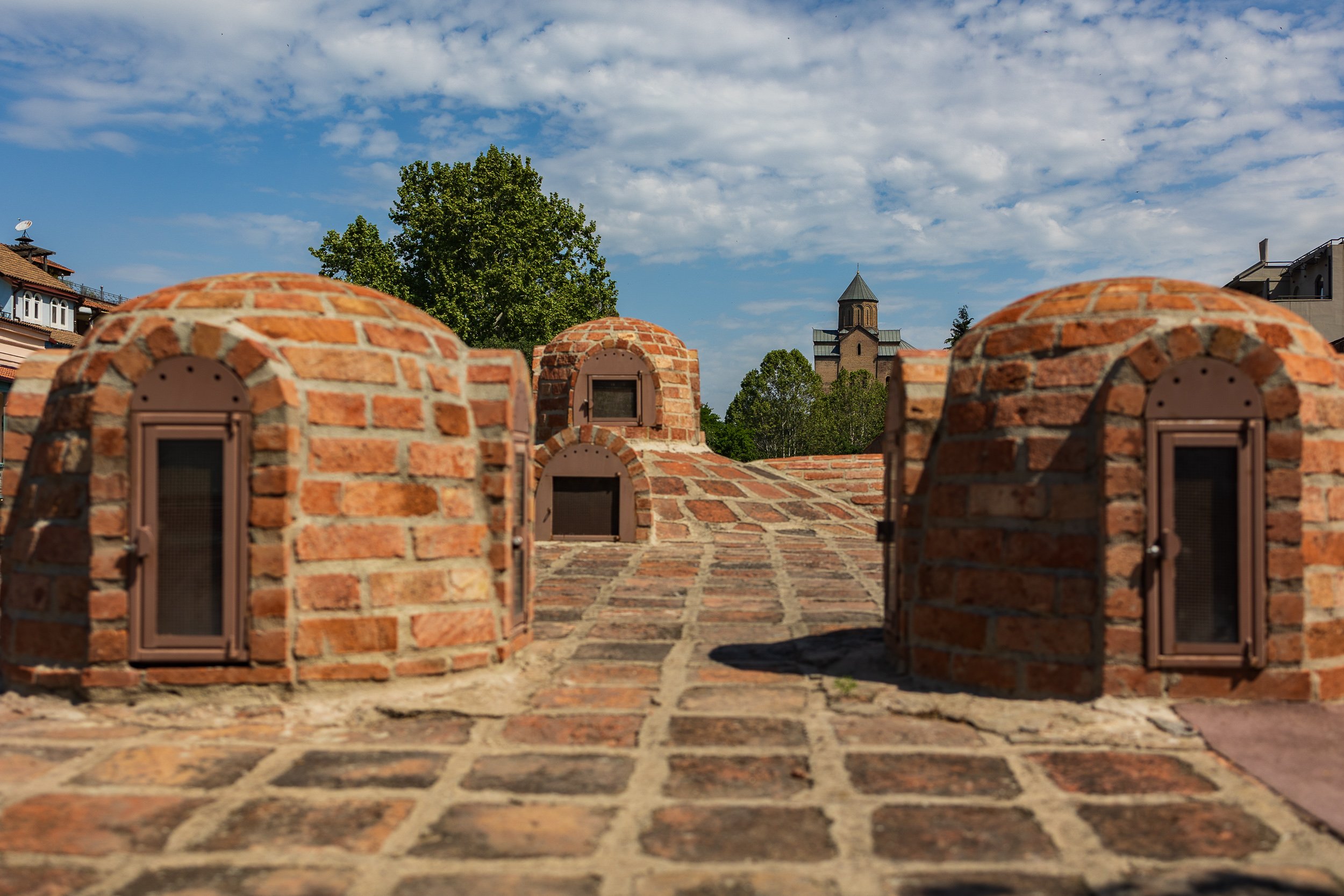  Abanotubani, the sulphur bath district, domed brick bathhouses built into the hillside, still in use after centuries. 