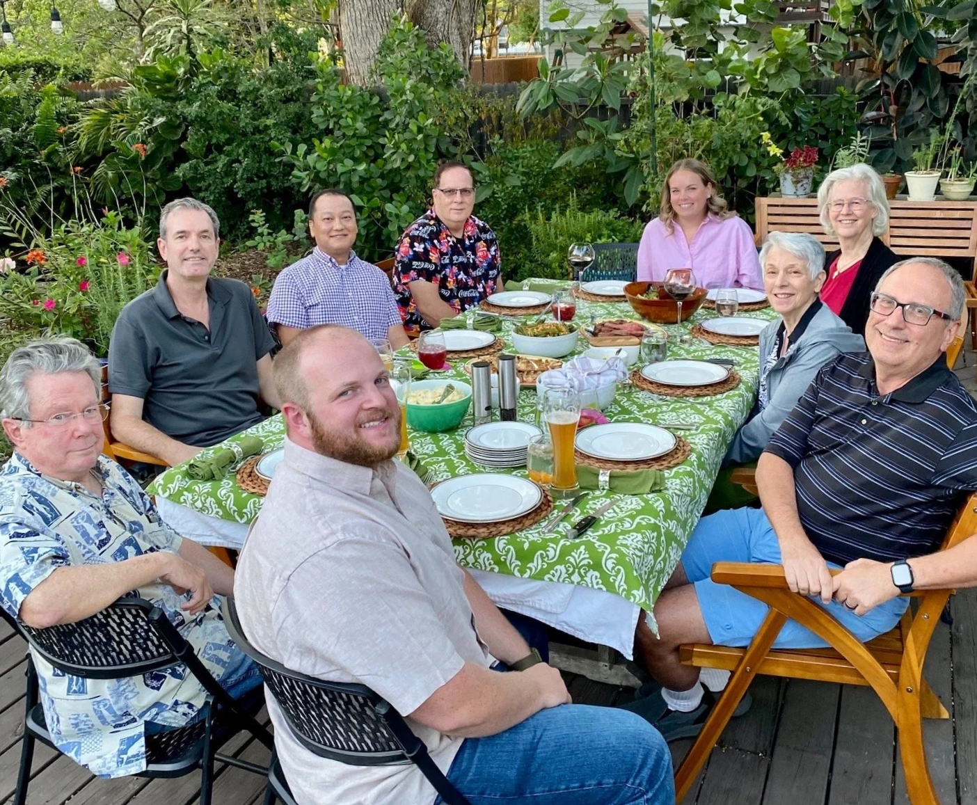 group of church members at dining table outdoors