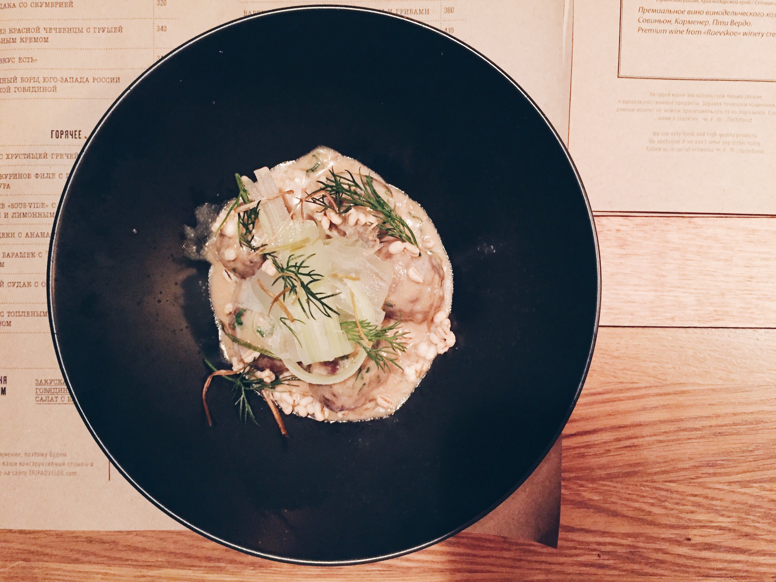 Meatballs in a tarragon sauce with onions.