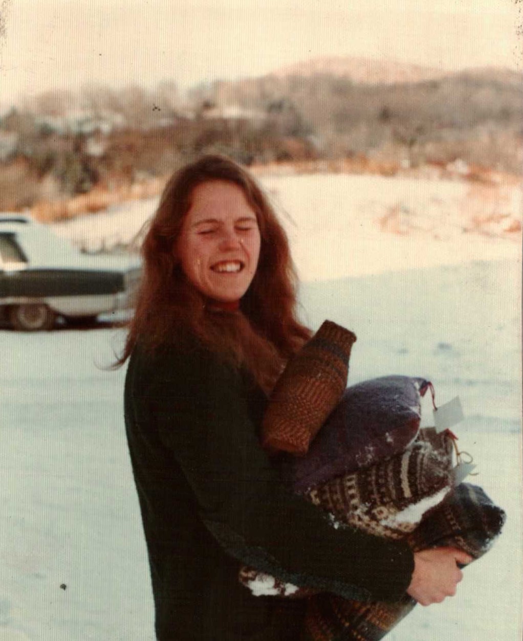 Carol Holding Pillows in the Snow.jpg