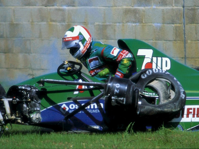 Andrea de Cesaris climbing out of his demolished car, Silverstone 1991.
