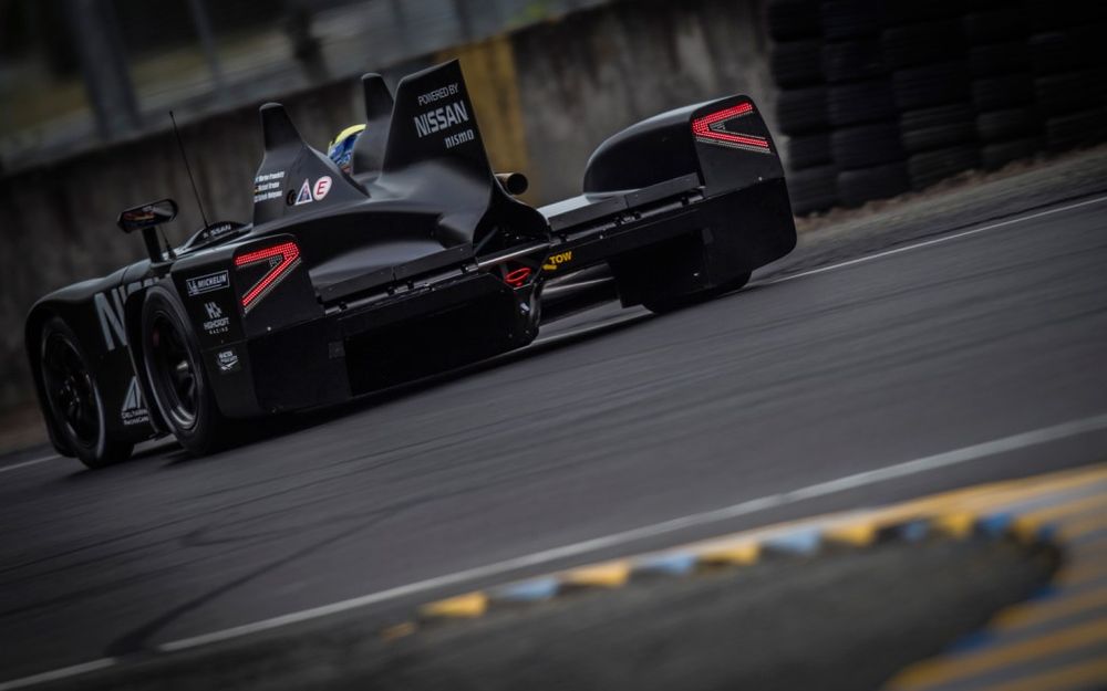 The beautiful Nissan DeltaWing during the sunset at Le Mans during the early hour of the race