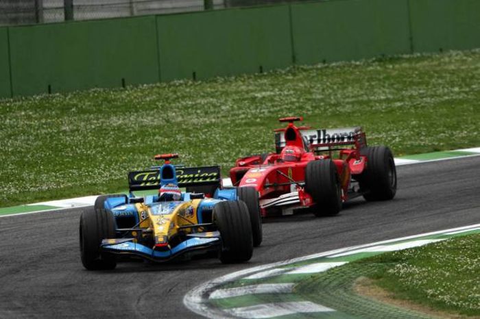 Alonso holding up the Ferrari of Schumacher to claim his third consecutive victories at Imola