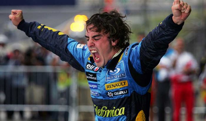Alonso celebrates his first world titles at the parc ferme in Sao Paulo