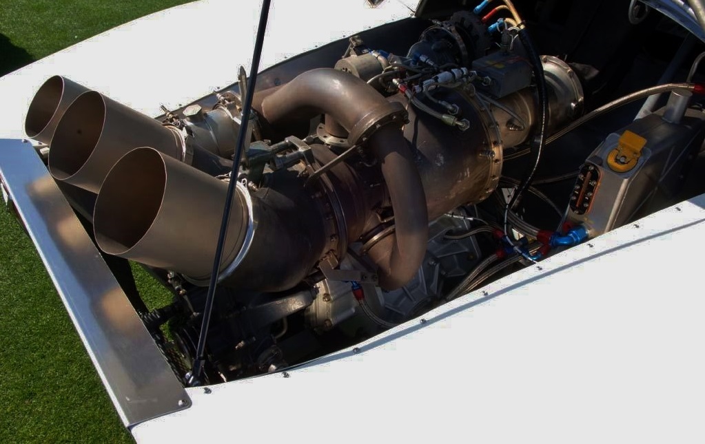 The turbine engine showing its exhaust and wastegate pipe (left).