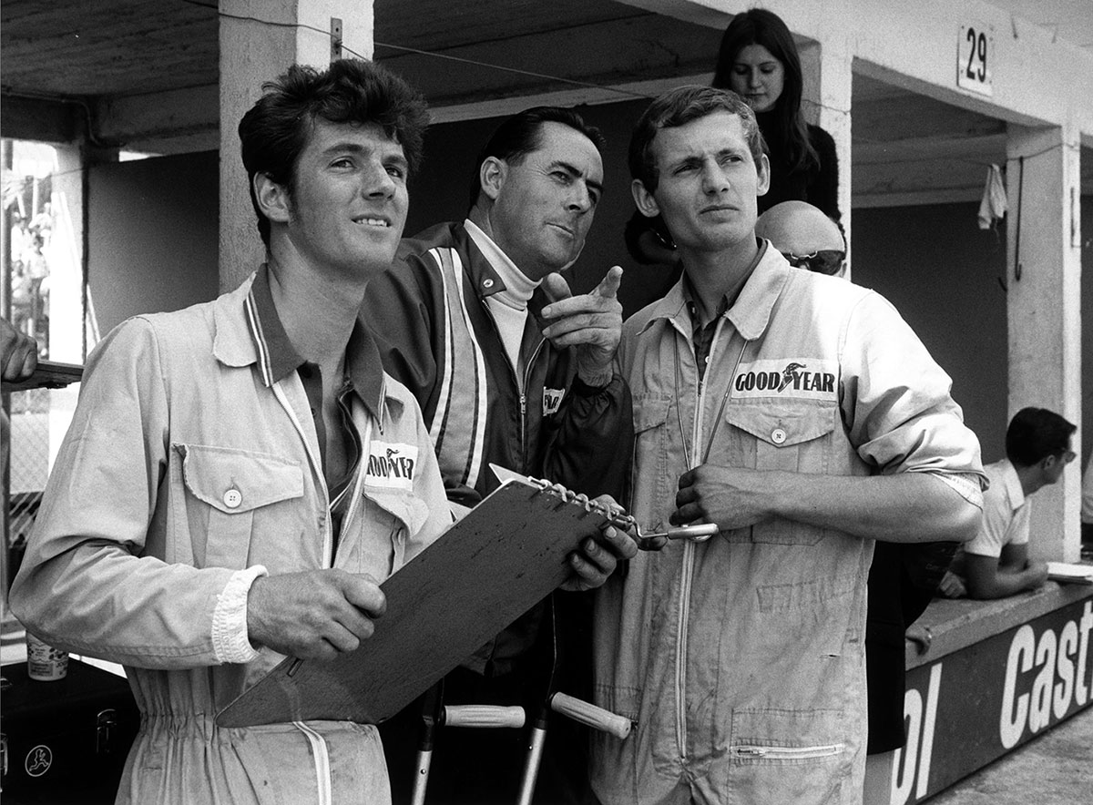 Sir Jack Brabham (center) and Ron Dennis (right), Nürburgring 1969.