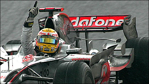 Hamilton celebrates his world title after crossing the line at Interlagos