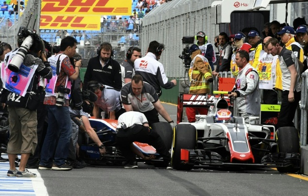 Engineers from both Haas and Manor tried frantically to free Haryanto and Grosjean after their collision during practice of the Australian Grand Prix