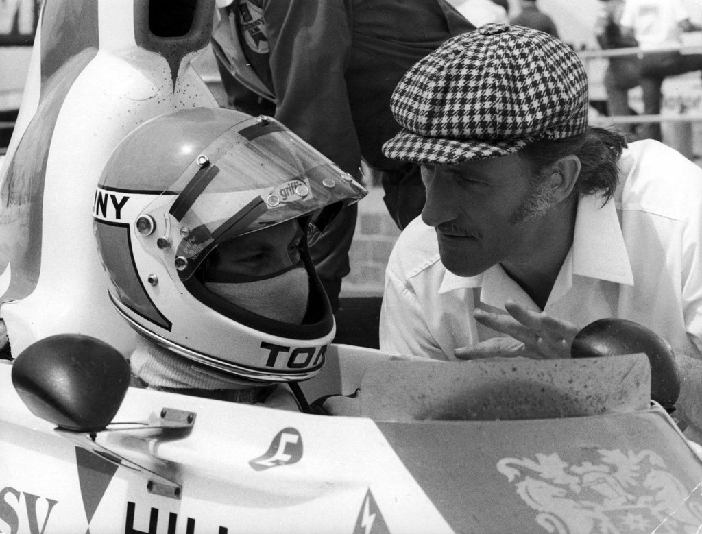 The charismatic champion having a chat with his apprentice: Graham Hill and Tony Brise before the start of the 1975 British Grand Prix