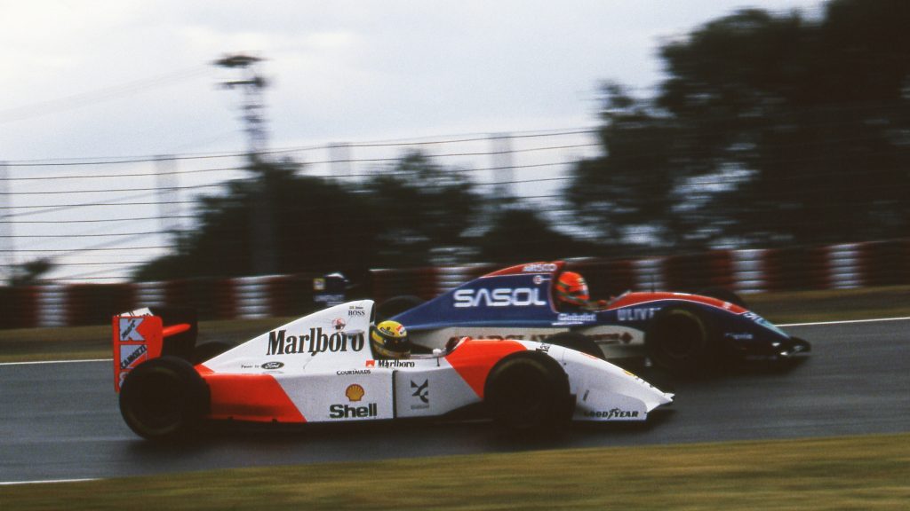 Senna angrily attacks the hard-charging Eddie Irvine.