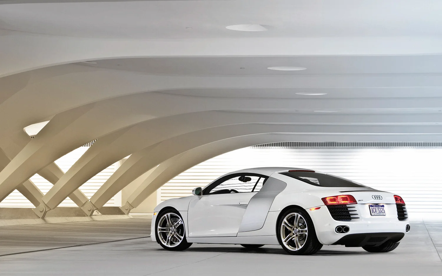 2012-Audi-R8-V8-FSI-Quattro-rear-three-quarters.jpg