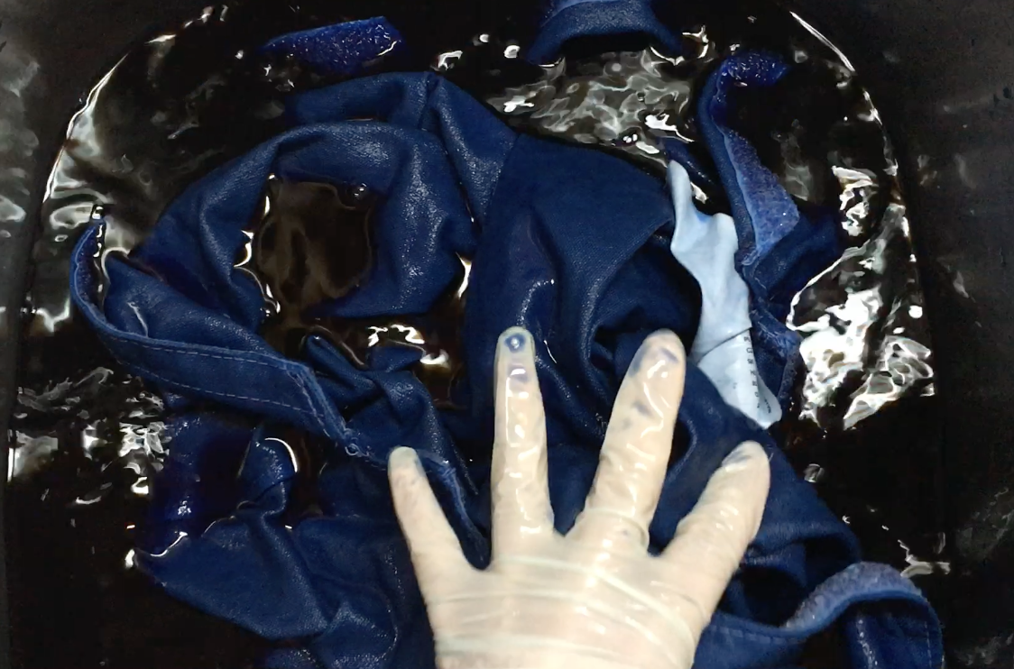 mixing the dye in my stainless steel sink basin