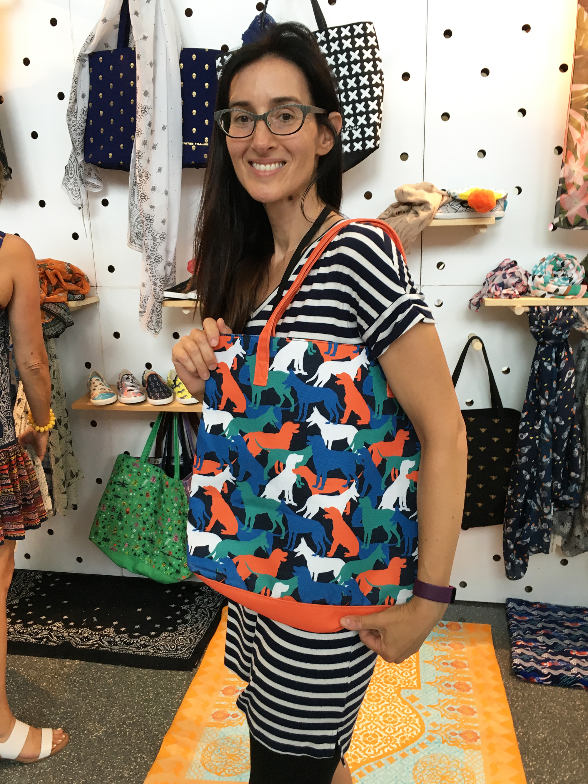 at the Printed Village booth posing with my dog pattern tote bag!