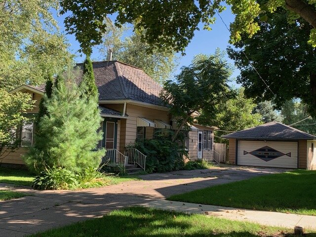 This little fixer upper is a 2 bedroom home with one full bath. The living and dining room open to each other. There are hard wood floors and nice woodwork throughout. The kitchen is large and the full bath is off of the kitchen. There is an enclosed front porch and a side porch as well as a large detached double garage and a smaller single detached garage off the alley. The yard is large and fenced. This home is being sold to settle an estate and will be sold as is where is with no warranties or guarantees of any kind.