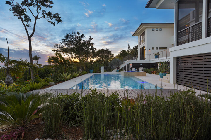   1. Light: &nbsp;Colorful skies and coastal water blues reflect in the windows and off the clean white exterior of this Sanibel Island Coastal Retreat. The ever-changing quality of light provides an essential element of this design, transforming fro