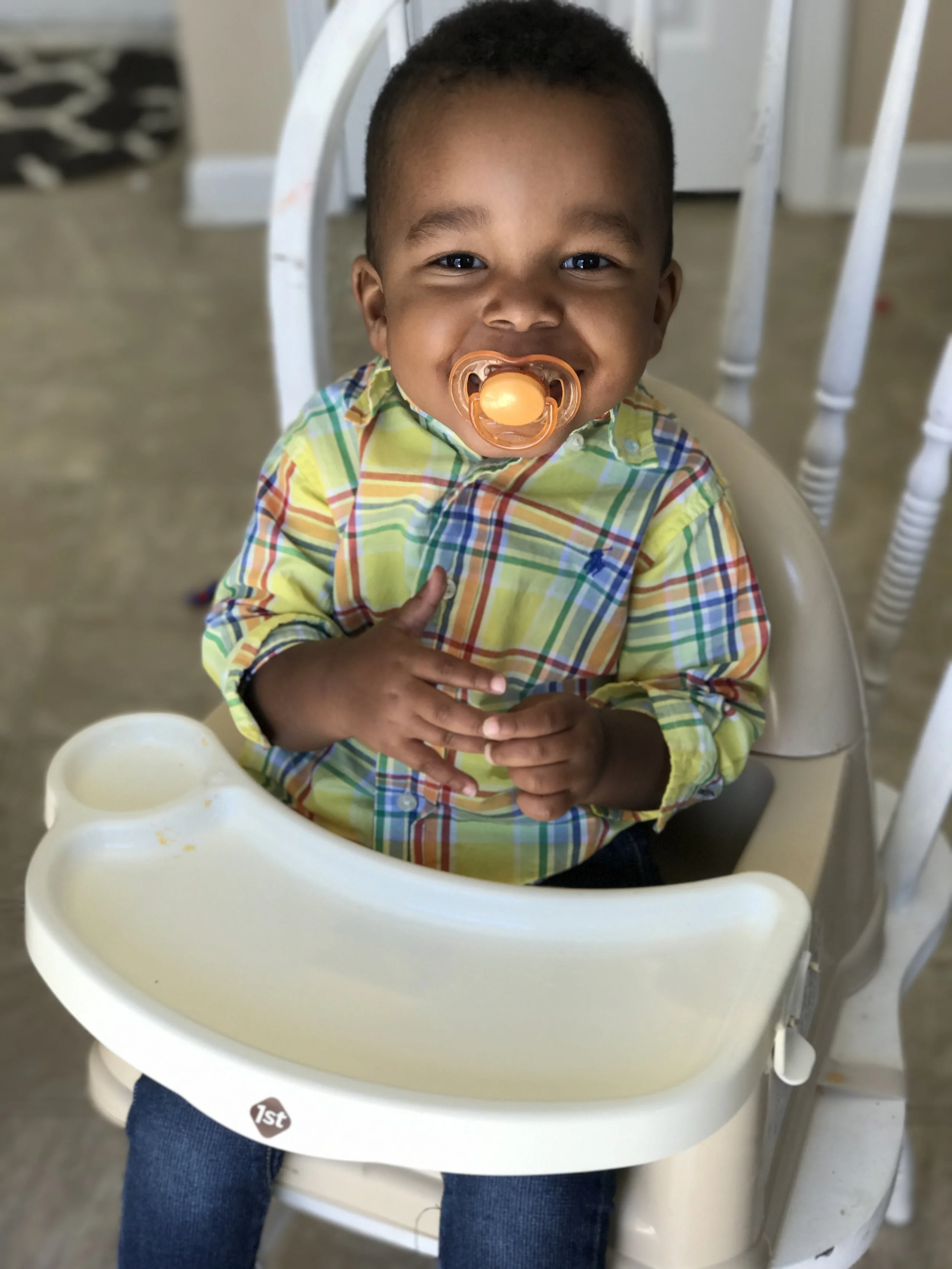 Sweet Micah will realize one day how much fun it is to eat!