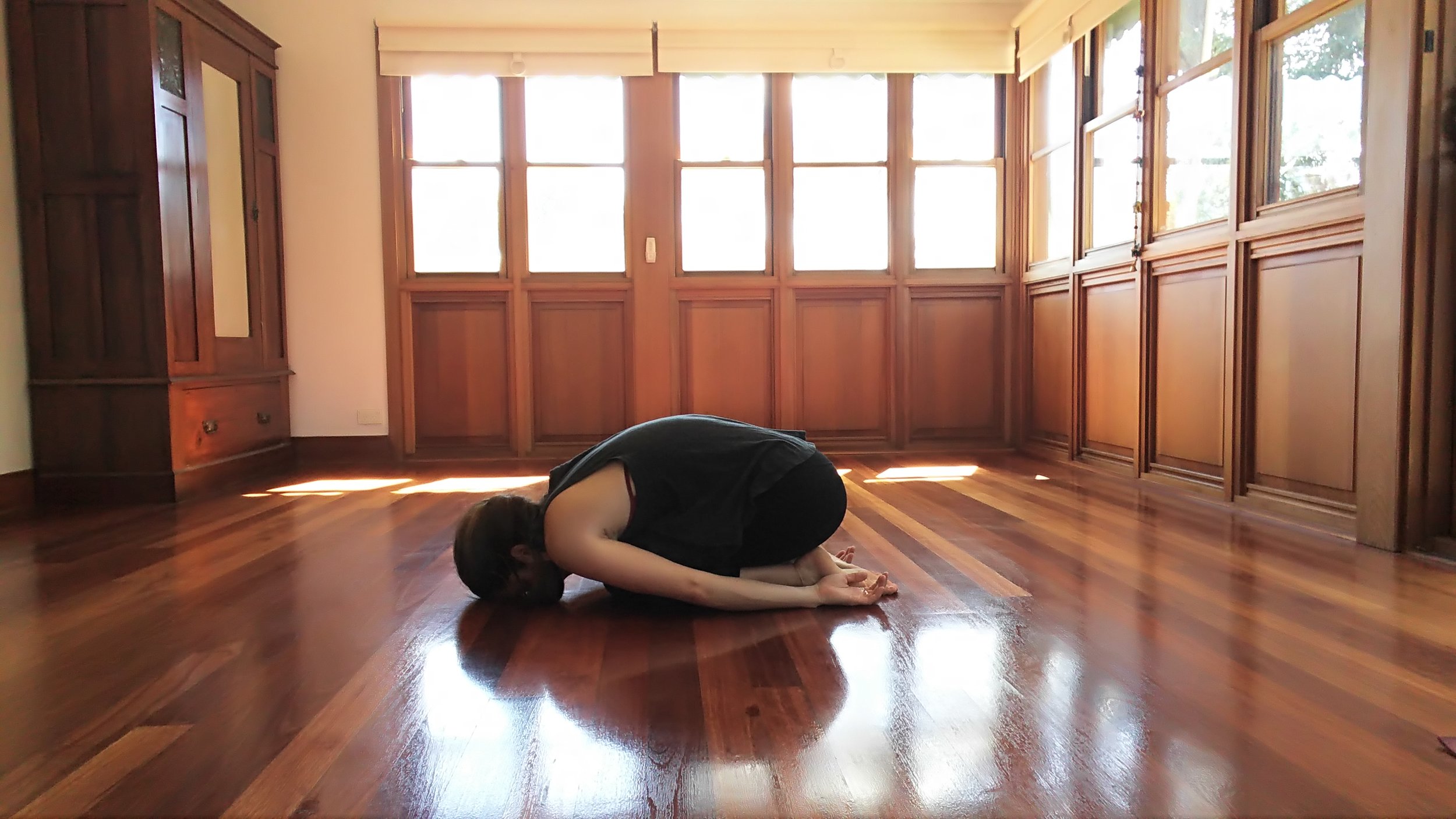  Rest. Childs pose. Bring feet and knees together. Allow head to rest on the floor or a block. Bring arms towards feet. Allow hips to fall towards the feet. 