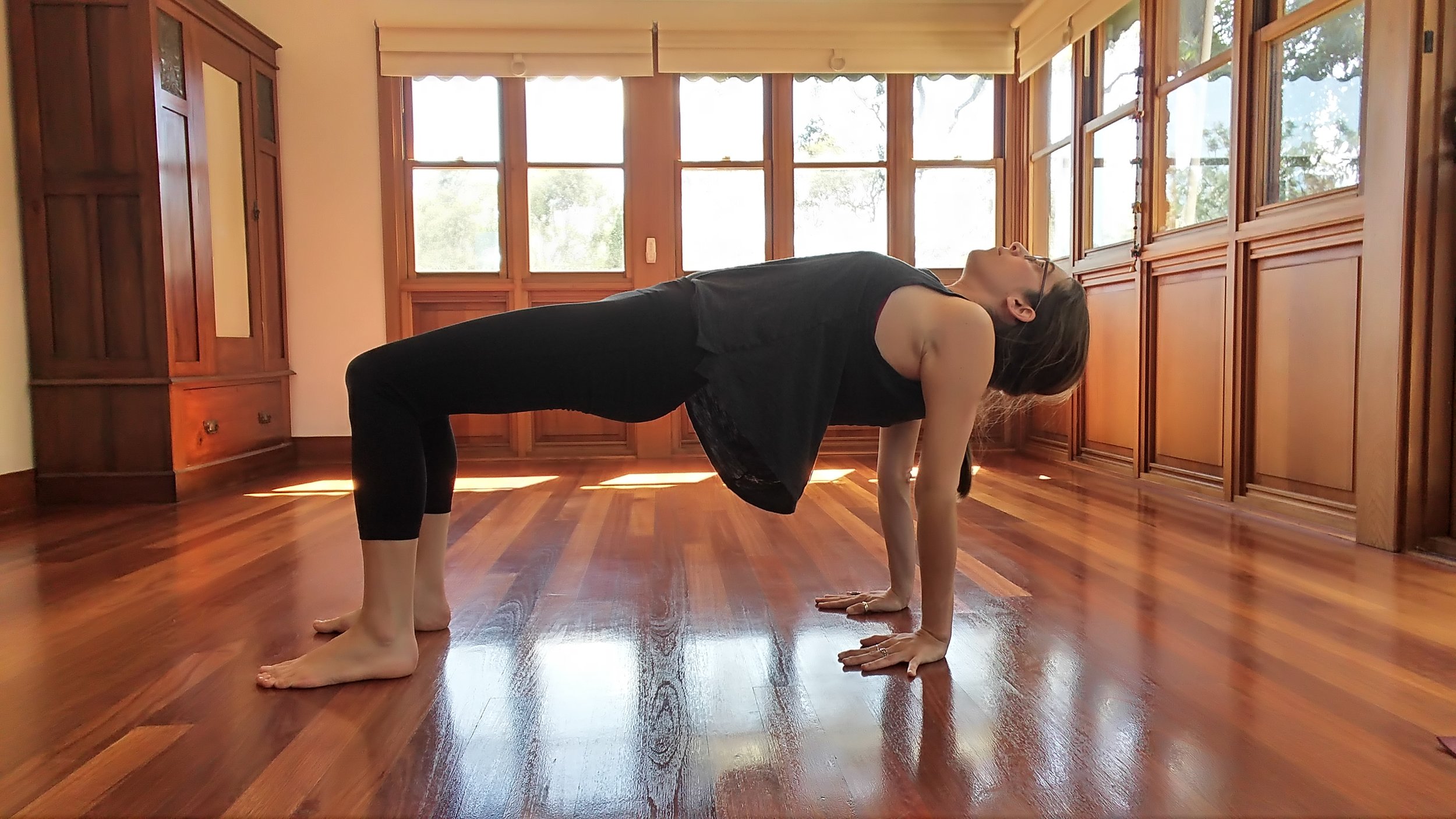  From the last pose, ground into hands and feet. Engage belly and pull pelvis up into a reverse table top position. Broaden through front side of the body. Feel the stretch in the shoulders as well. 