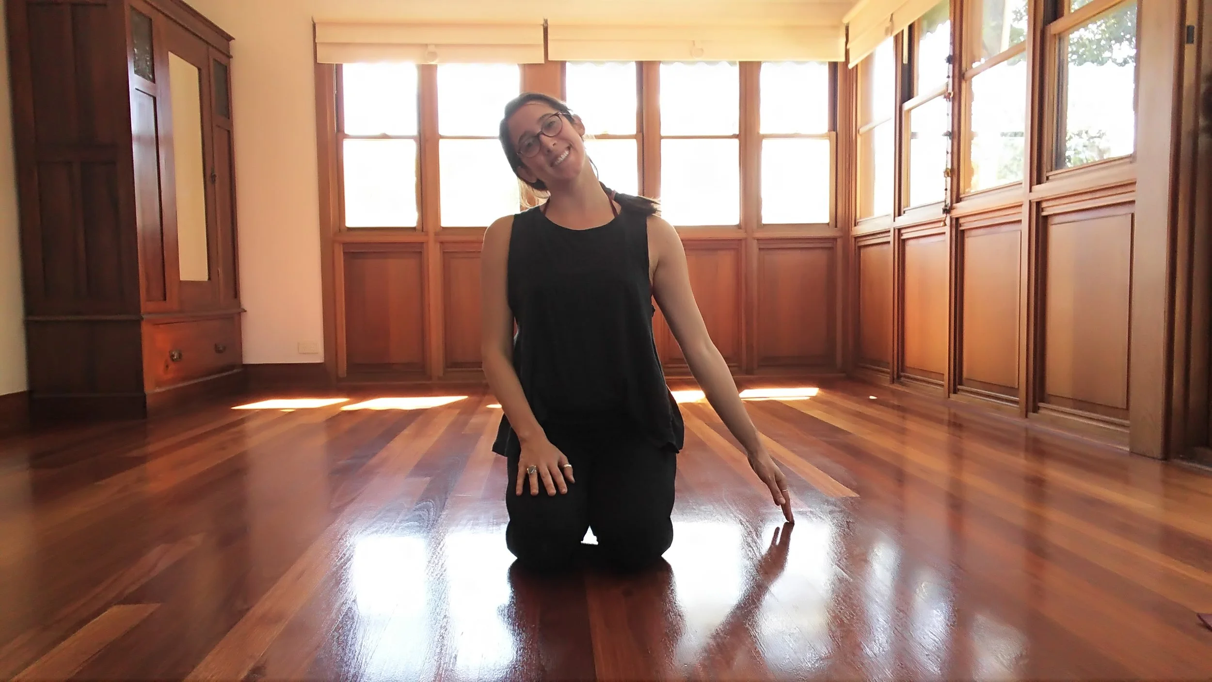 Sit on the knees or in any comfortable seated position. Bring the left hand to the ground beside you. Allow gravity to pull the right ear towards the right shoulder.