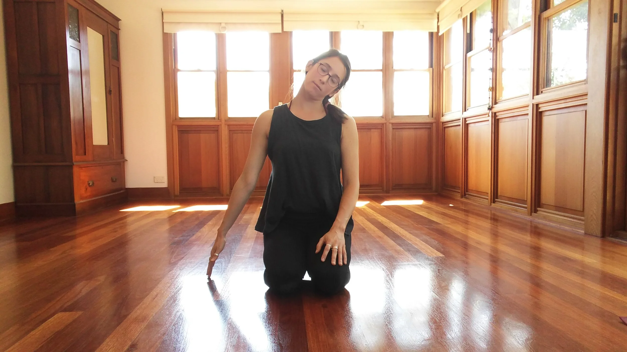 Sit on the knees or in any comfortable seated position. Bring the right hand to the ground beside you. Allow gravity to pull the left ear towards the left shoulder.