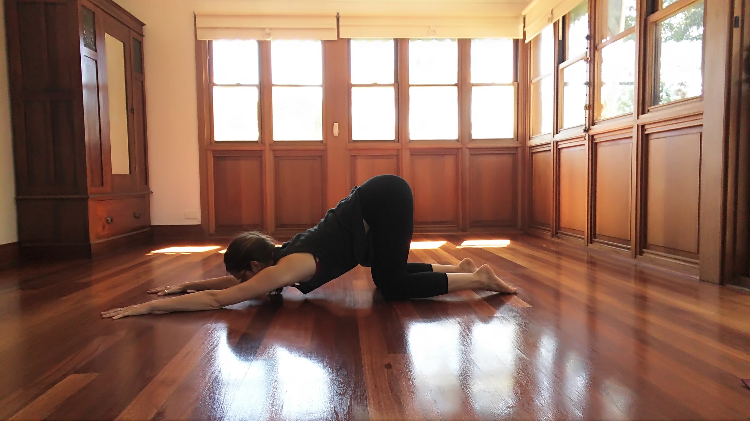  Stack the hips on top of the knees. Let your arms reach forward as you guide your heart towards the ground.&nbsp; 