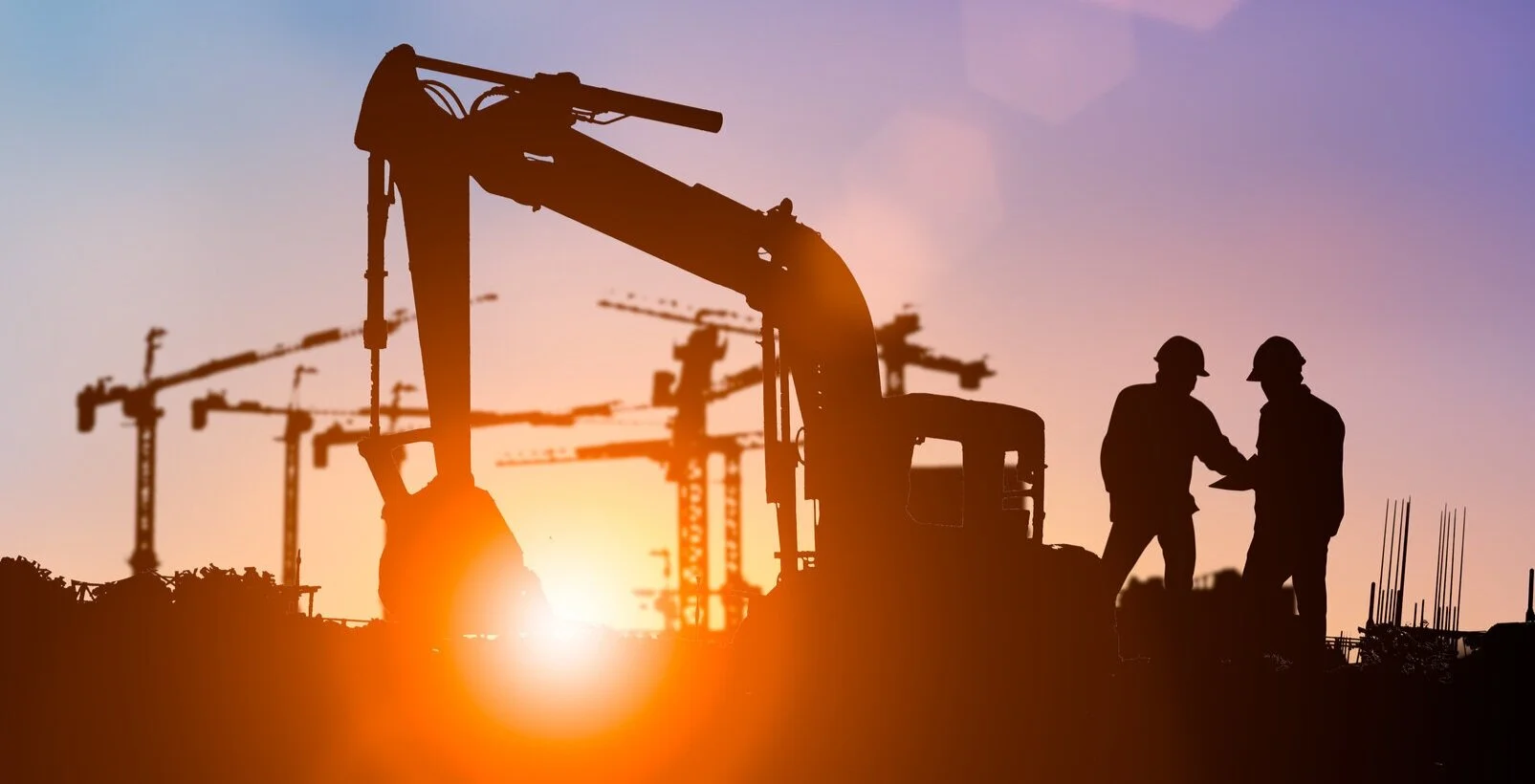 Silhouette-of-engineer-and-construction-team-working-at-site-over-blurred-background-for-industry-background-with-Light-fair.Create-from-multiple-reference-images-together-1150409549_2426x1239.jpg