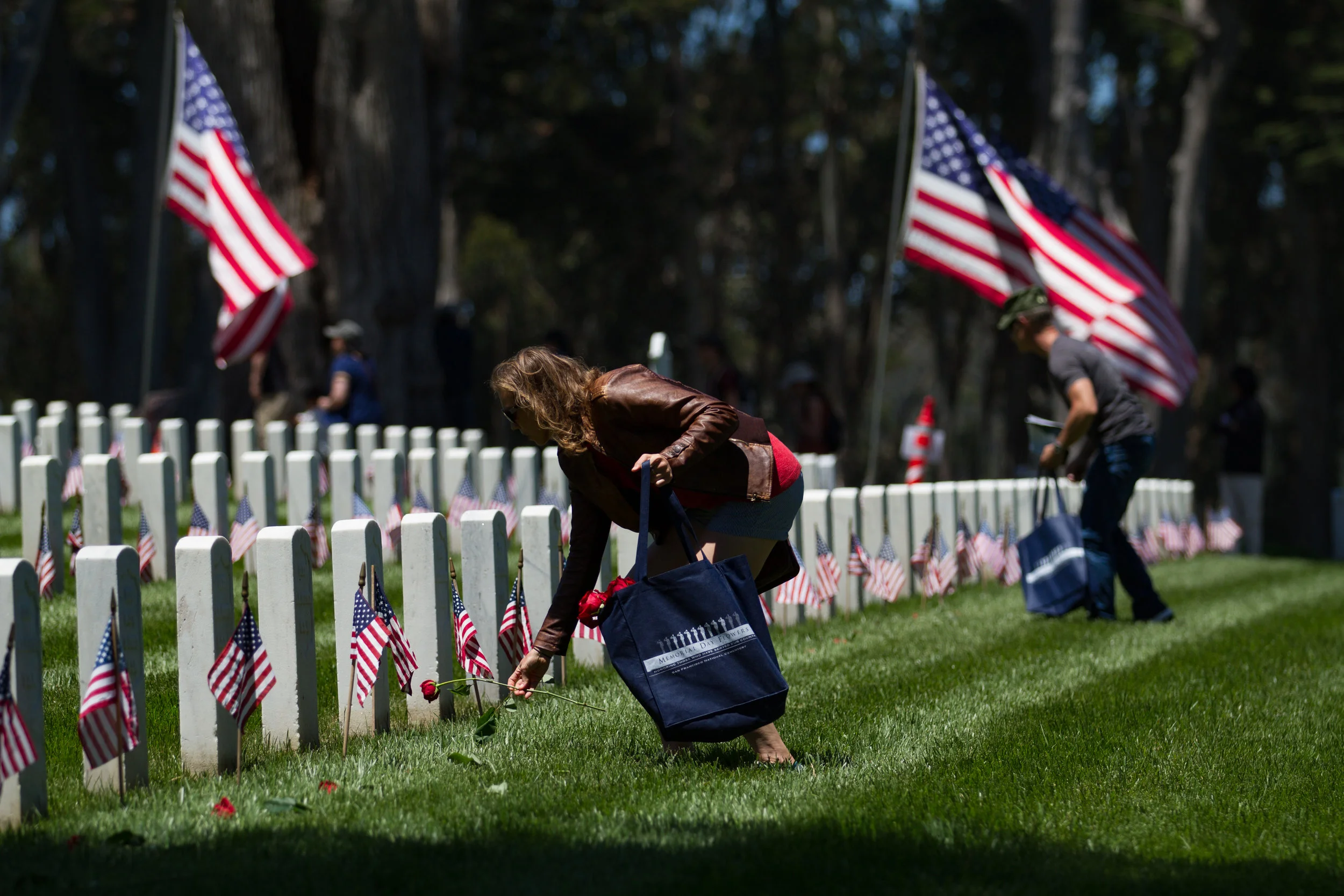 Attendees of the 2018 Memorial Day Commemoration at the Presidio in San Francisco lay roses across the graves of fallen service members. The 150th anniversary pays homage to the over 1 million Americans killed while serving in the armed forces and the annual commemoration is the largest in the West. Services began with a 21 gun salute from the U.S. Army’s Pacific Division 75th Training Command and featured speakers Senator Dianne Feinstein, Lieutenant Governor Gavin Newsom, and San Francisco Mayor Mark Farrell.