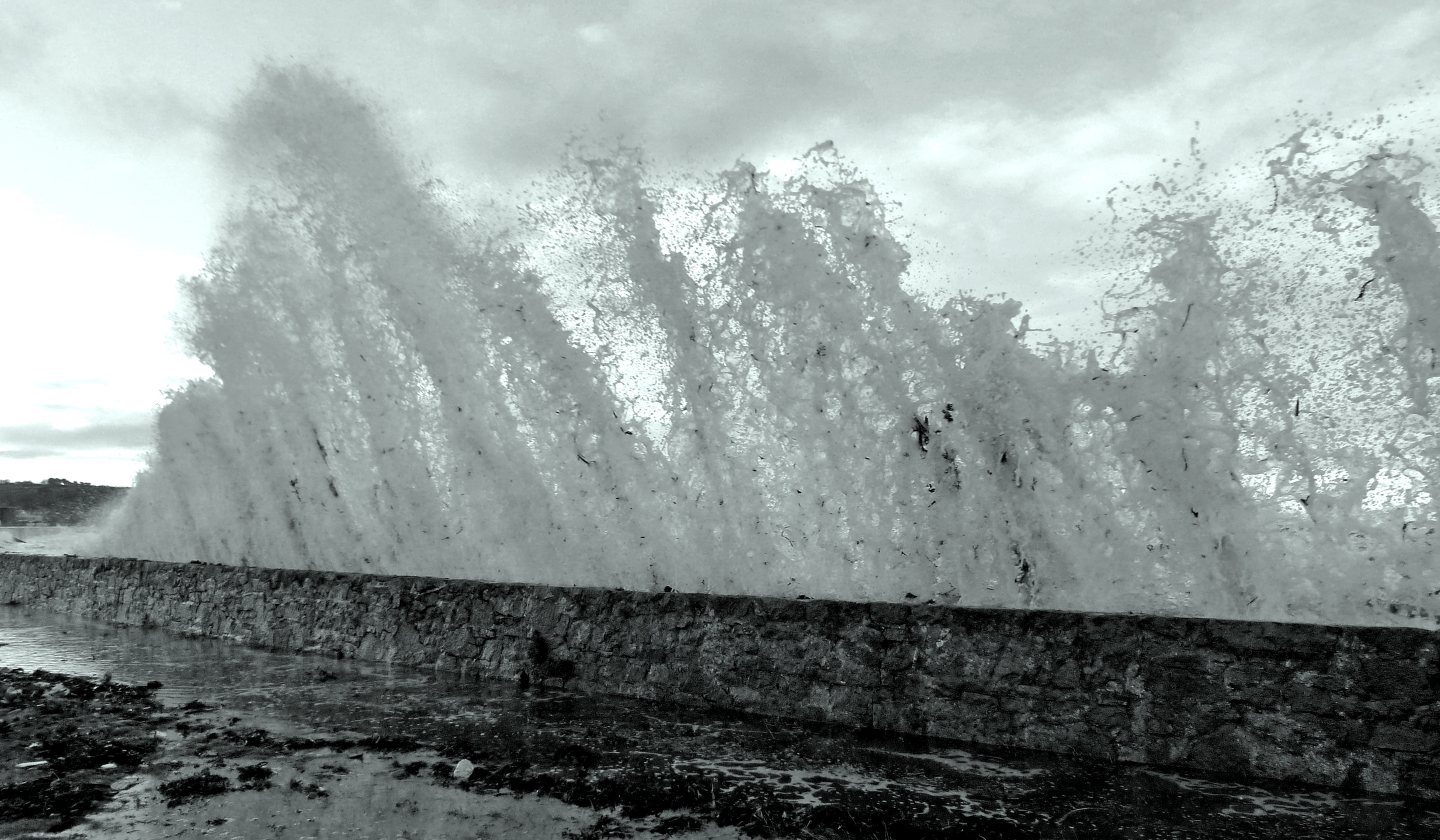 High tide at Vazon with the tail end of Storm Imogen surging over the sea wall.