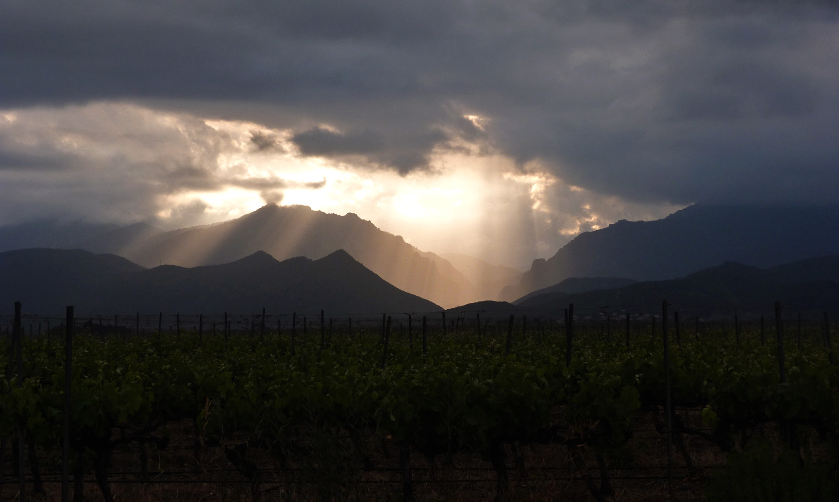 The dark, evening skies above Aghione fields