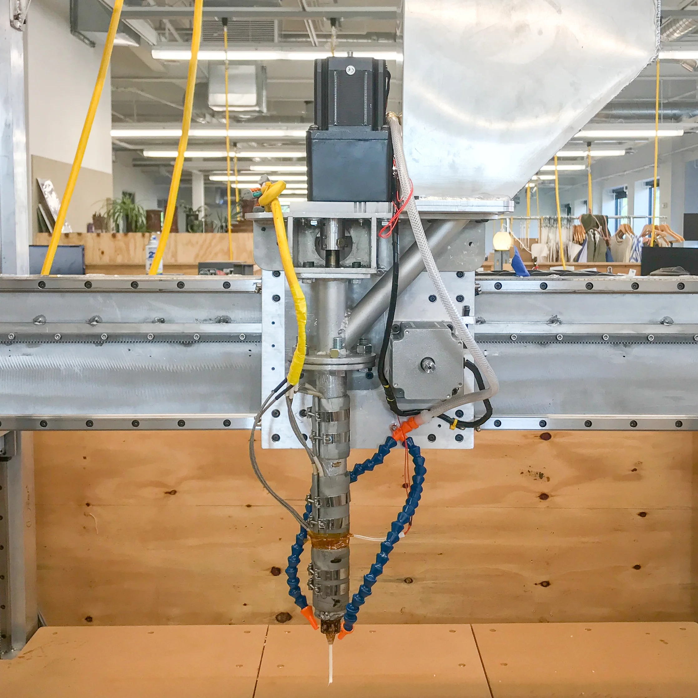 We began the design of the entire V2 machine by designing the V2 pellet extruder first, then designing and building a motion platform to support it. This version is a 10x performance improvement over V1, weighing roughly 30lbs and capable of processing 5lbs of plastic per hour.