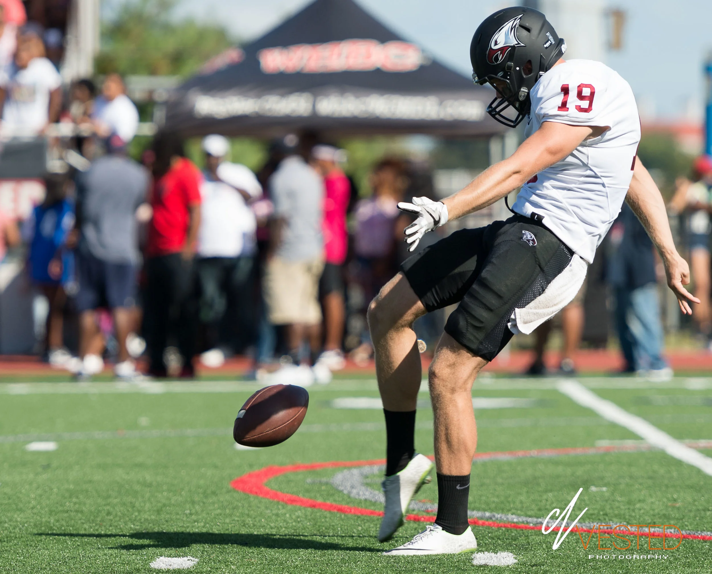 NCCU punter Nathaniel Tilque prepares to sail the ball.