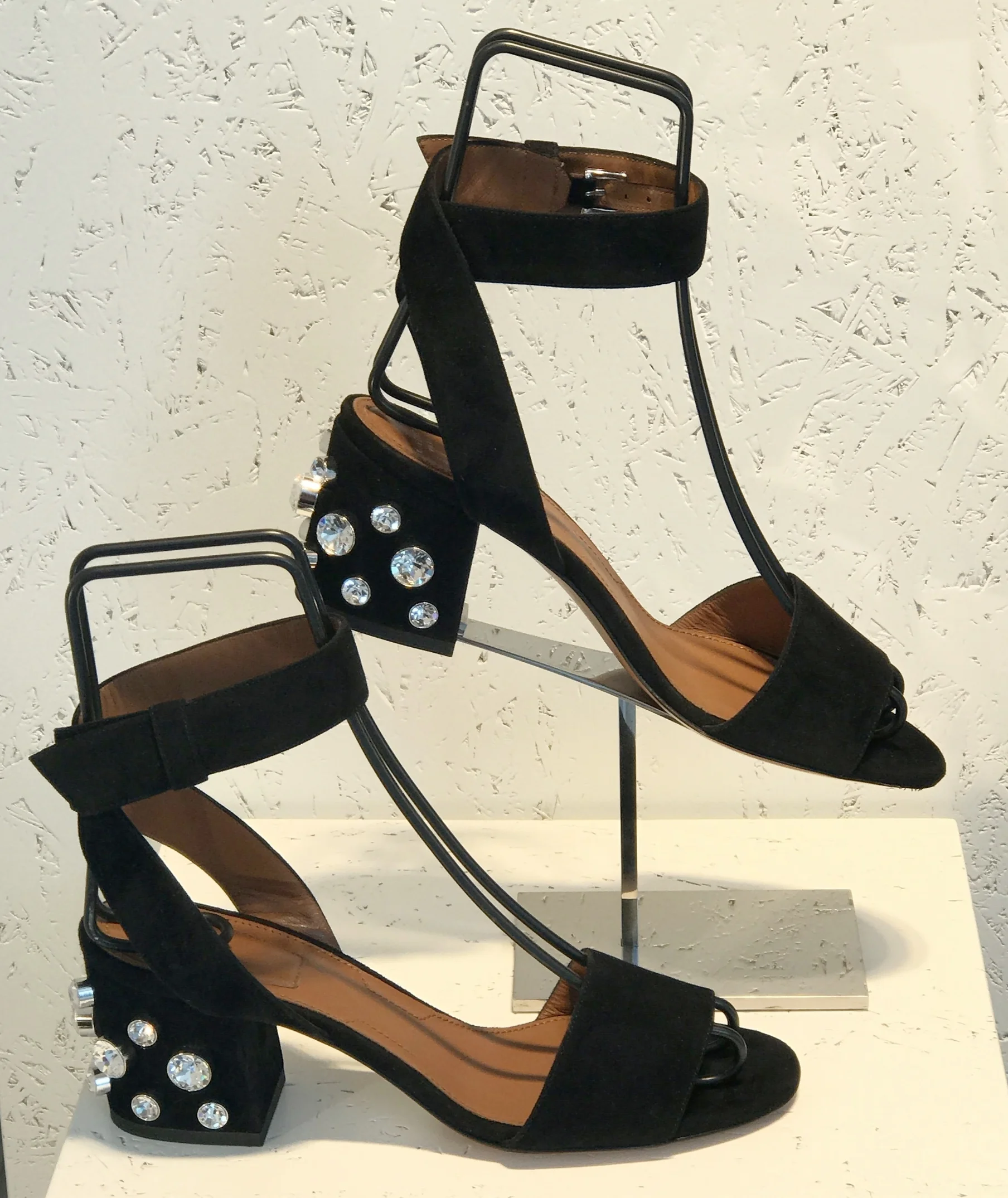 From Givenchy... The embellished block heel and the wrapped ankle make the sandal one of Spring's latest looks. A great sandal for cropped pants or longer, flowing hem lengths.&nbsp;