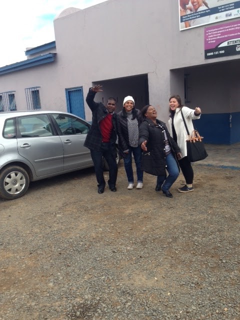 A picture of my team with Mr. G outside the PinPoint/Botshabelo Mobile Clinic