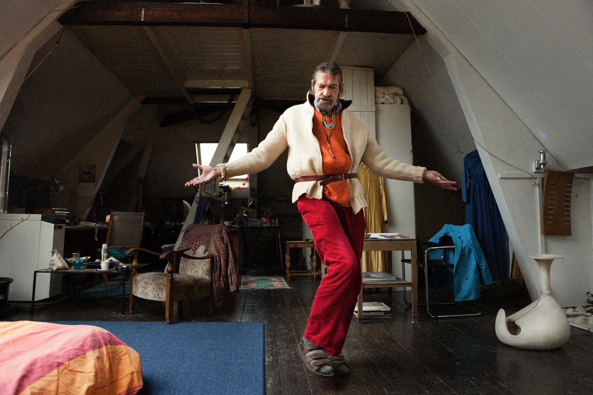 Guido dancing for me. In the background the female dresses he used to wear in the past.