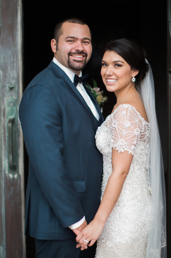 Navy suit for the Groom and intriciate beading and lace for the Bride I www.avenueivents.com.png