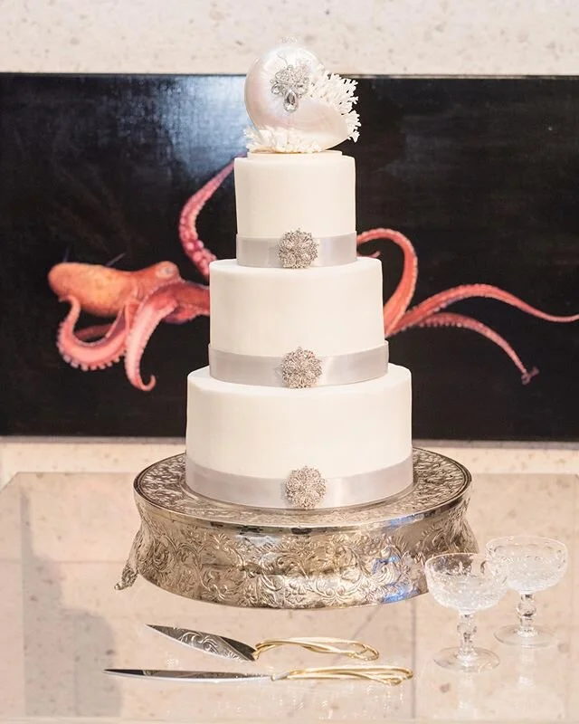 Coastal confection and a work of art! Link in bio for all wedding day details