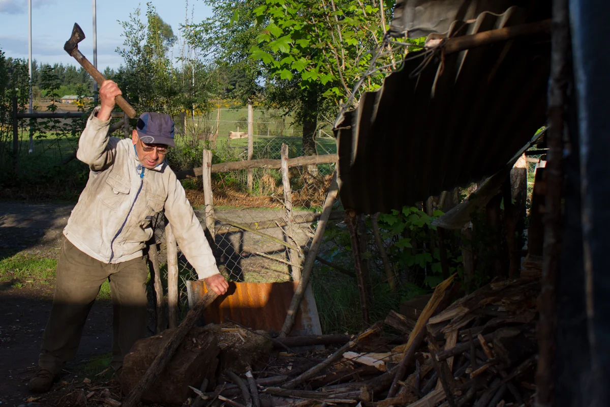 He cuts wood to heat the house during the nights and the brutal winters.
