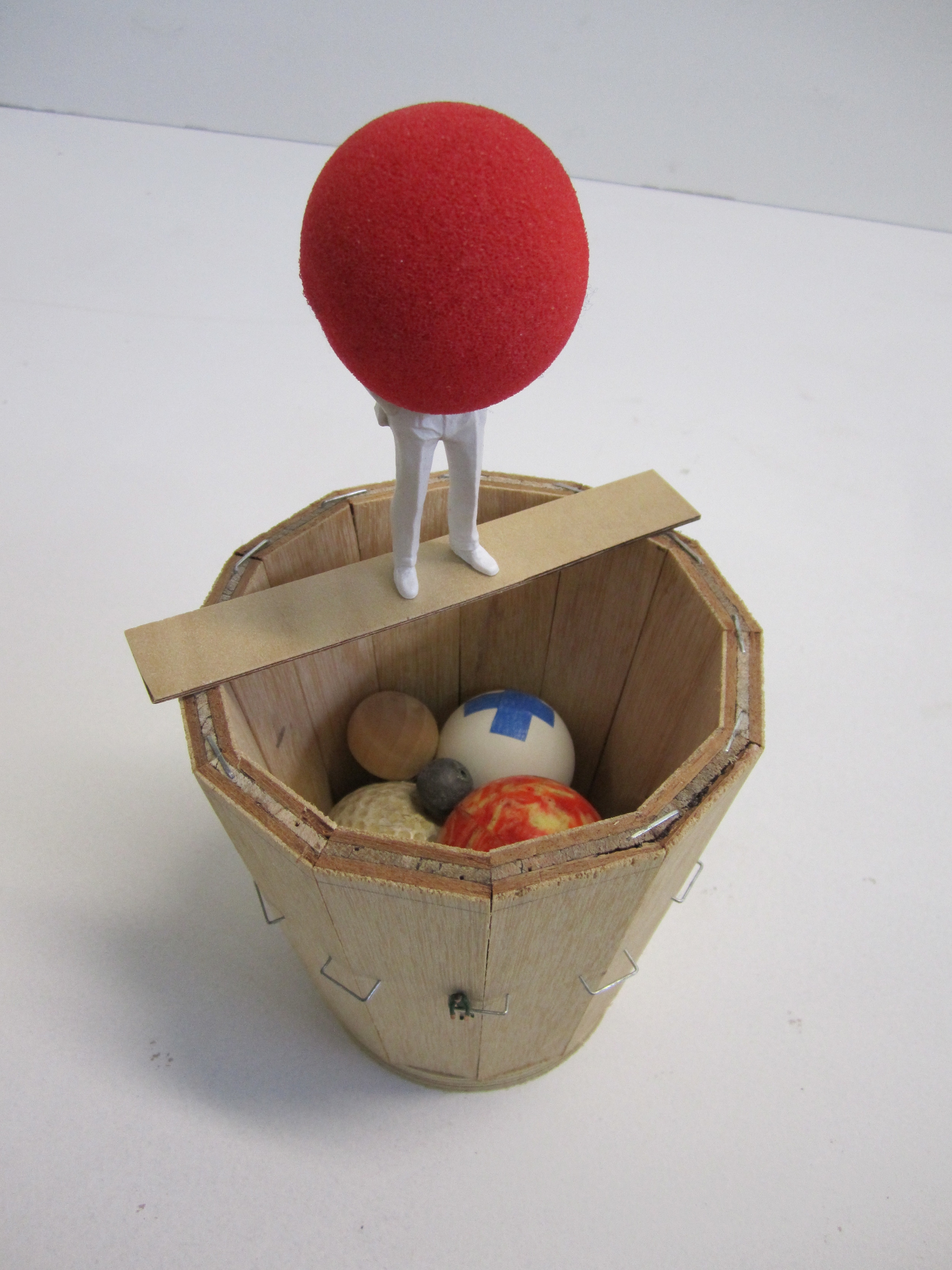   Orrery Storage, 2011    Foam, wood, mouse ball, golf ball, lead ball, rubber ball, table tennis ball, metal staples 24 x 13 x 13 cm   