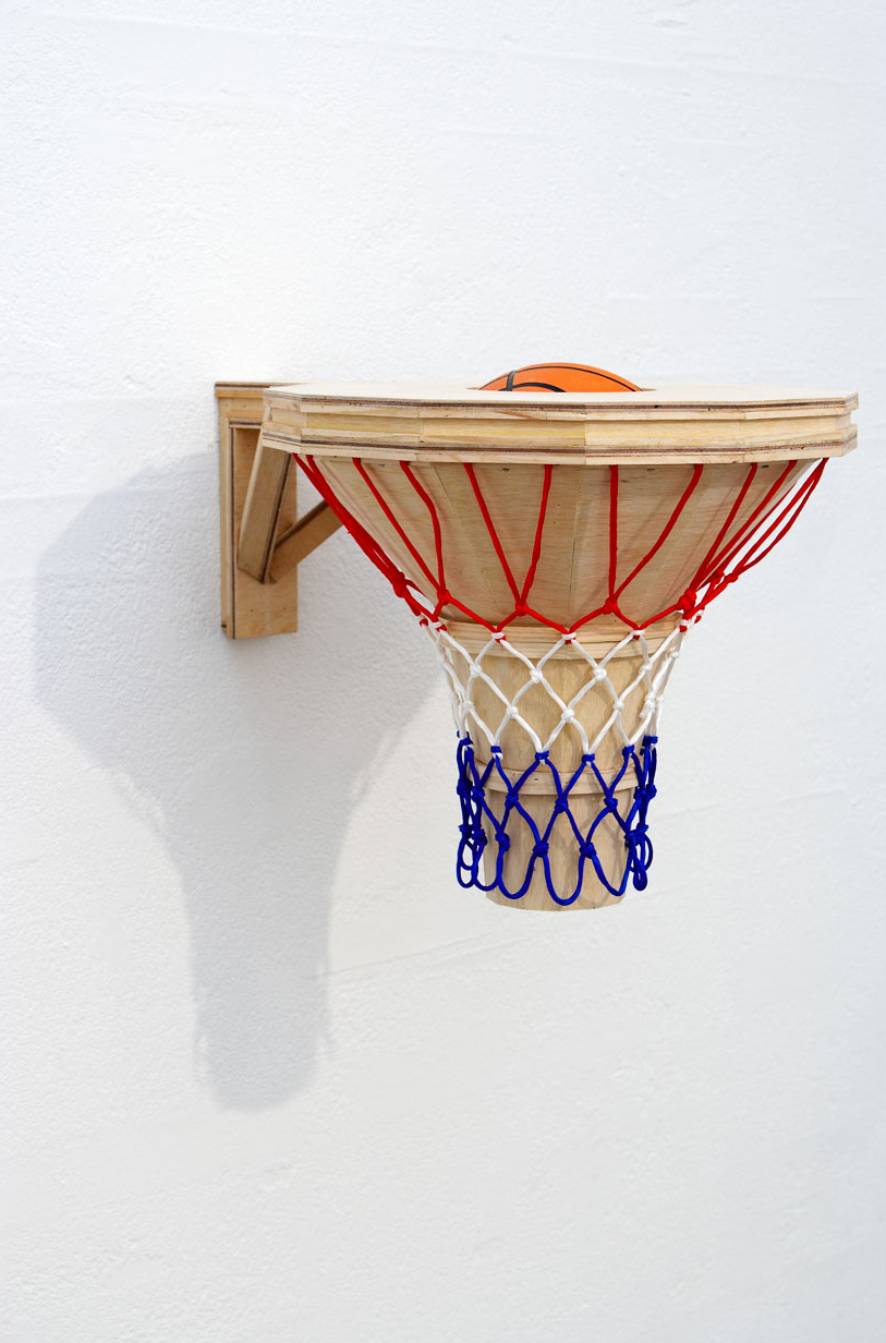   BASKET CASE, 2007   Plywood, pine, hoop net, basketball   48 x 63 x 50 cm  