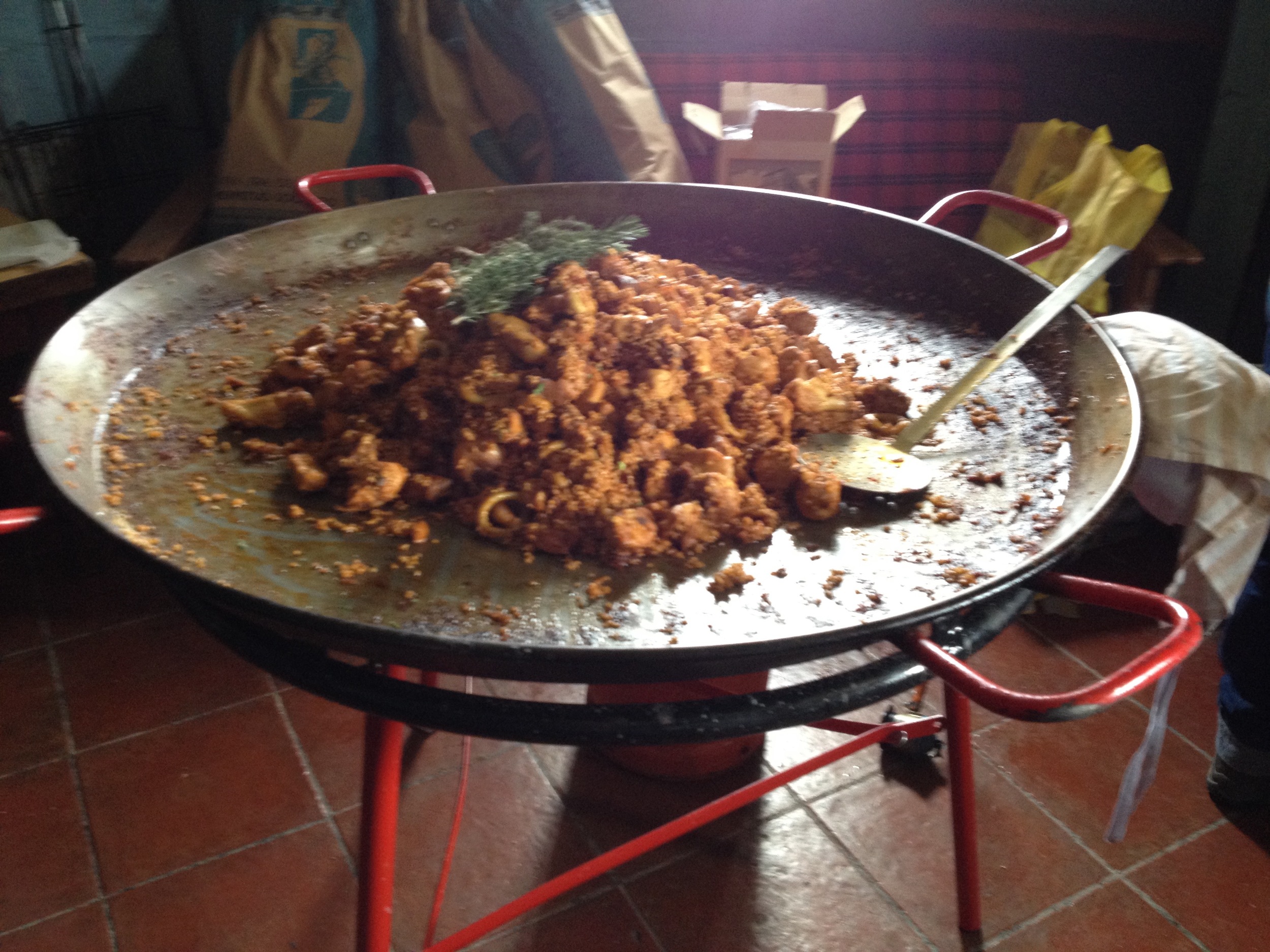 A giant dish of paella - what Spaniards call a paellaca (a BIG paella) - cooked in a hiker's hut atop the Sierra Nevada mountains.