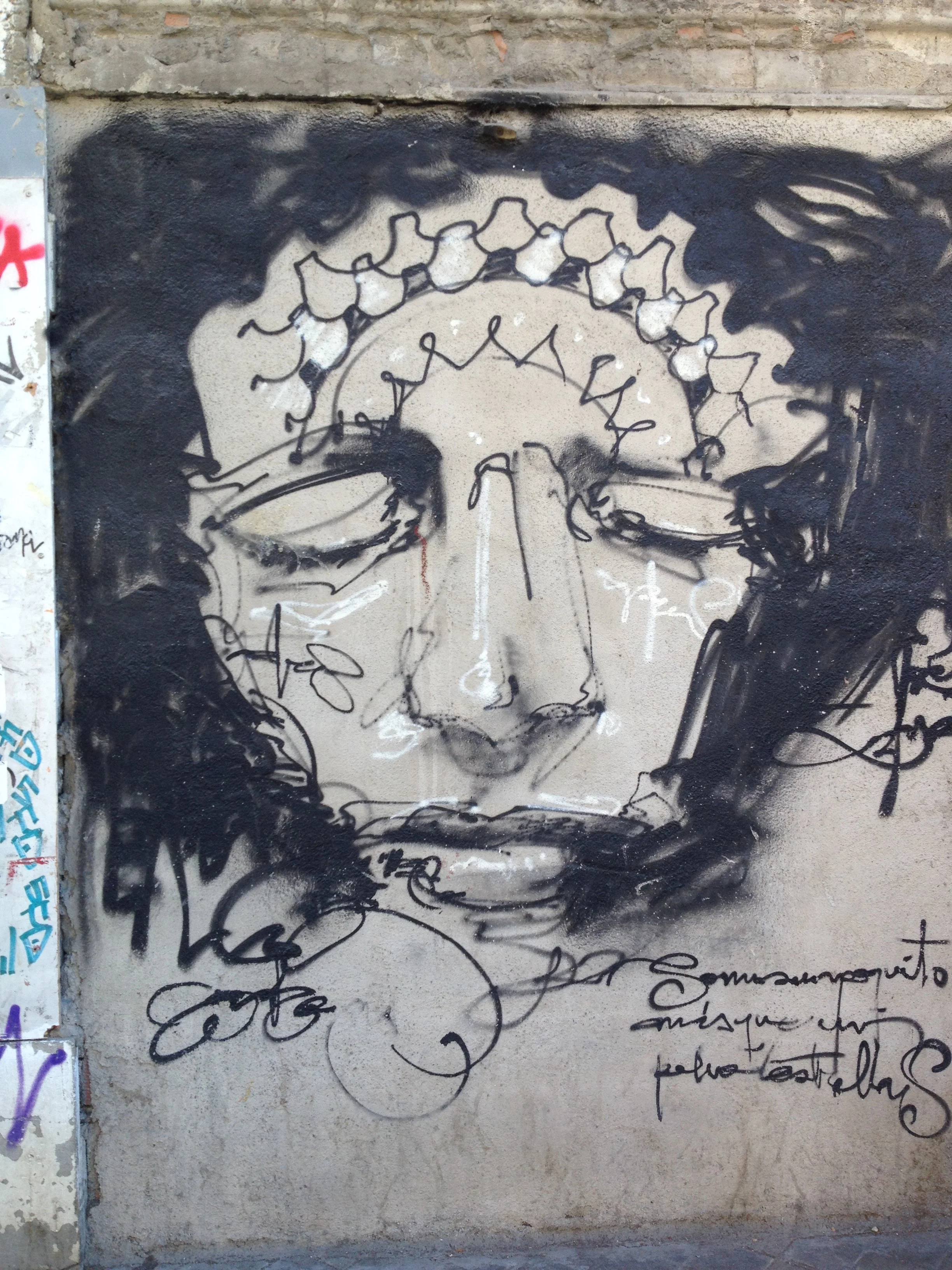 Graffiti by El Niño de las Pinturas, a Granadan street artist, in the Realejo neighborhood (the old Jewish quarter of the city).