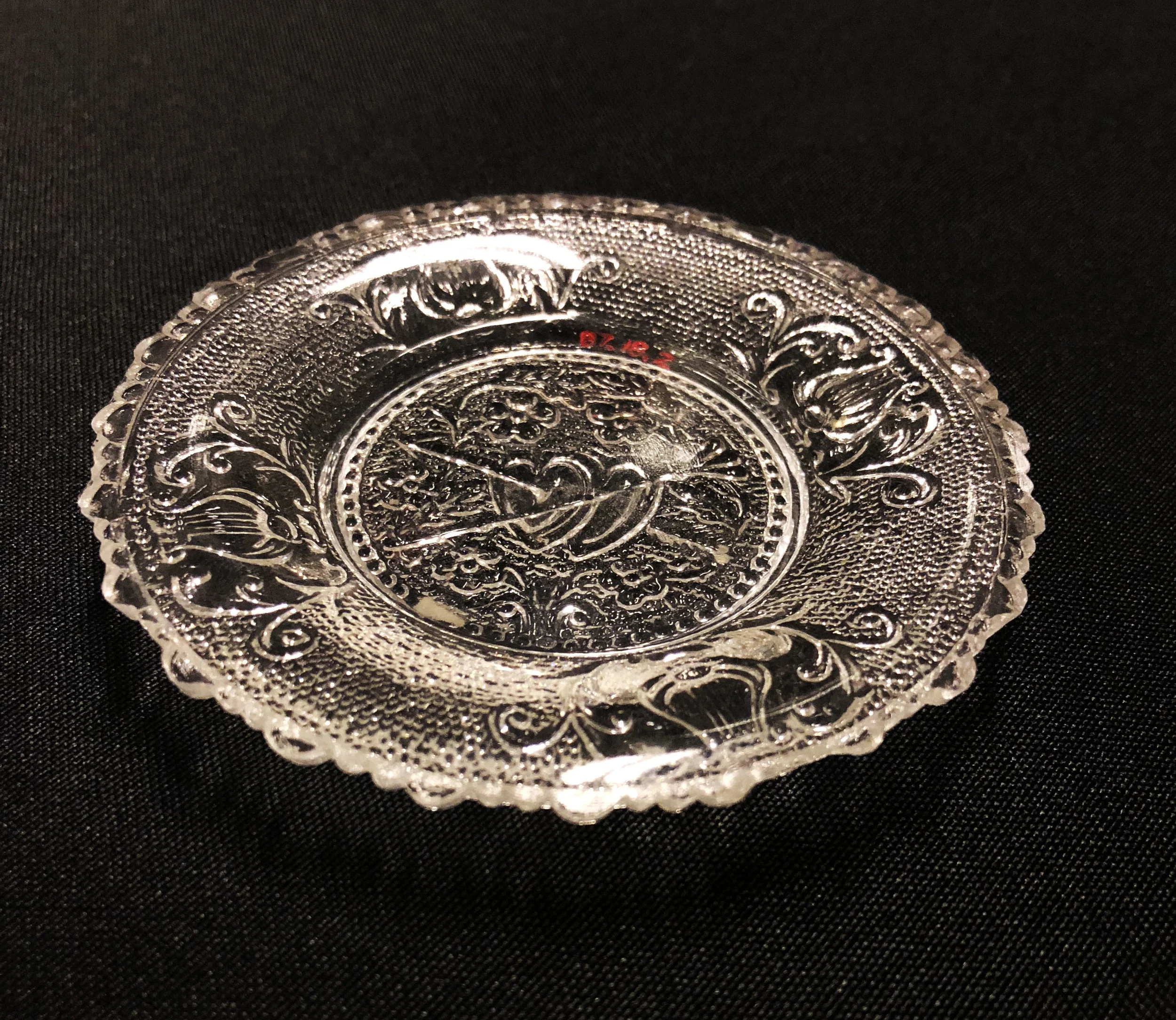 (click to enlarge) Possibly Boston & Sandwich Glass Company, Cup Plate, ca. 1830, pressed glass, 3 3/8 inches, Gift of Polly Gibbs, LSU MOA 87.18.2.